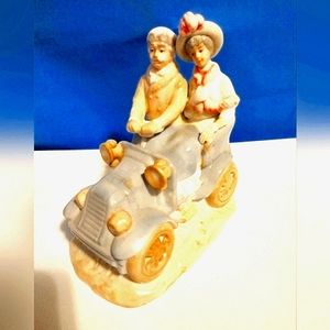 Porcelain/Ceramic Couple in the car figurine